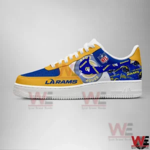 Side view of blue and gold Los Angeles Rams sneakers with team logos on a gray background.