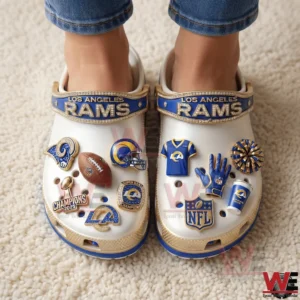 Person wearing Los Angeles Rams clogs with football themed charms!