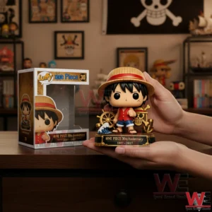 Hand holding colorful Luffy anniversary collectible figure with base.