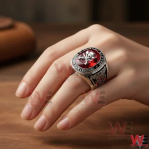 Silver Lynyrd Skynyrd ring with red stone skull and crossed guns worn on hand!