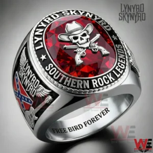 Lynyrd Skynyrd Skull x Gun Ring 3 Close up silver Lynyrd Skynyrd ring with red gemstone skull and crossed guns emblem!