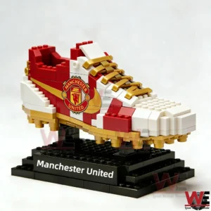 Manchester United brick football boot displayed on a black stand!