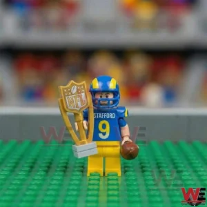 Football minifigure holding trophy and football on green field!