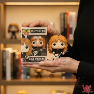 Dave Mustaine rock figure with guitar shown inside box and held in hand.