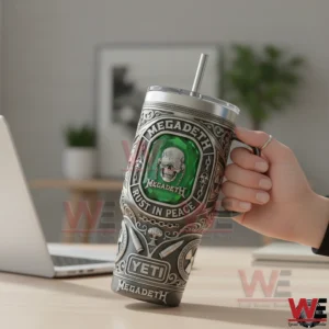 Megadeth Rust In Peace tumbler with green emblem held by hand near a laptop!