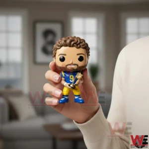 Matthew Stafford Rams MVP figure held in hand with living room background.