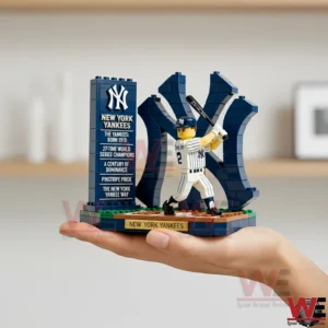 Hand holding brick New York Yankees batter model with large NY logo backdrop!