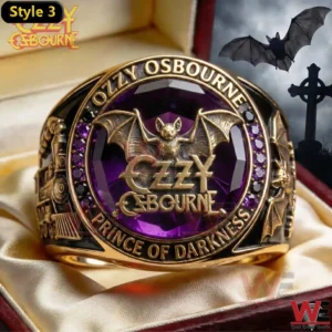 Gold Ozzy Osbourne ring with purple gemstone and bat emblem Prince of Darkness.