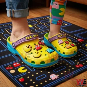 Child wearing yellow PACMAN themed clogs with character charms!