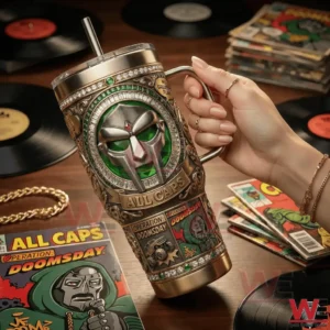 Hand holding Operation MF Doom insulated tumbler with metal finish among vinyl records!