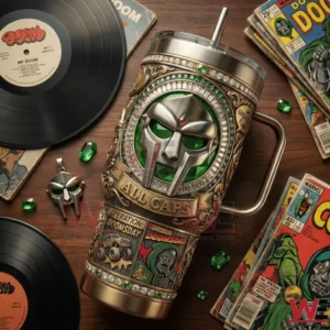 Operation MF Doom insulated tumbler placed on table with vinyl records and comic books!