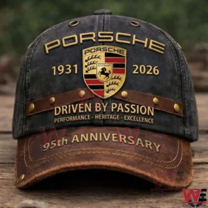 Porsche anniversary cap displayed on a wooden surface outdoors!