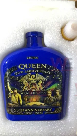 Blue commemorative bottle celebrating the Queen fifty fifth anniversary with band artwork!