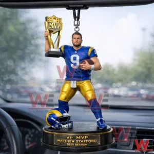 Football player car ornament holding a trophy and football hanging inside a car!