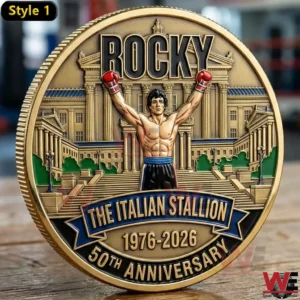 Rocky The Italian Stallion Fifty Anniversary coin showing Rocky with raised boxing gloves in front of a grand building.