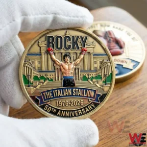 Hand holding Rocky The Italian Stallion Fifty Anniversary commemorative coin.