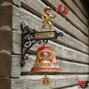 Gold and red Forty Niners anniversary wall bell mounted on a rustic wood wall!