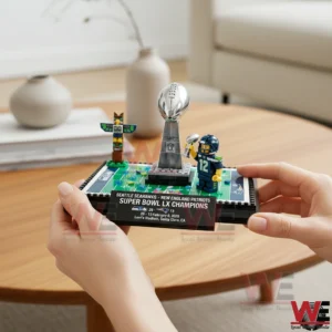 Hands holding Seattle Seahawks Super Bowl LX champions building brick set with trophy and player figure!