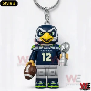 Seahawks eagle mascot keychain holding football and silver championship trophy.