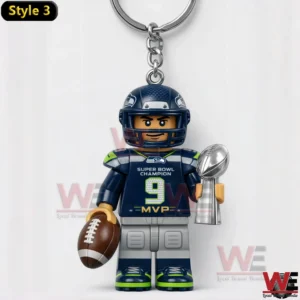 Seahawks player keychain number nine holding football and silver trophy.