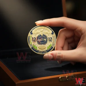 Hand holding Seattle Seahawks 2026 Super Bowl LX Twelfth Man commemorative coin above wooden display box.