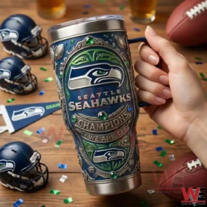 Hand holding Seattle Seahawks champions tumbler with football items!