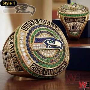 Gold Seattle Seahawks Super Bowl LX 2026 Champions ring with blue and green stones and team logo on top.