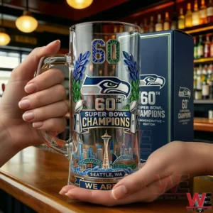 Hands holding Seattle Seahawks sixty th Super Bowl Champions commemorative beer glass!