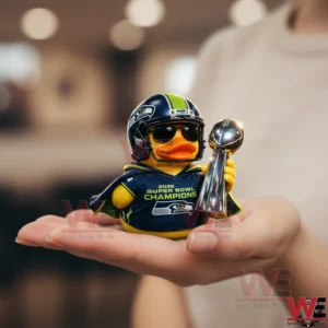 Seahawks champion duck with helmet holding trophy on a hand!