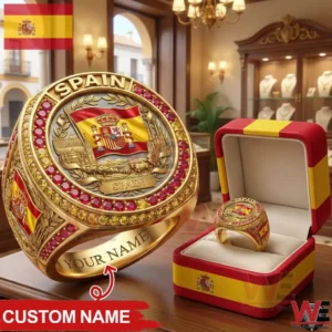 Gold ring with Spain emblem and red stones displayed in a jewelry shop!