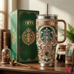 Decorative jeweled coffee tumbler beside green gift box on wooden table!