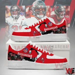 Red and white Tampa Bay Buccaneers sneakers with team logos and football players in the background.