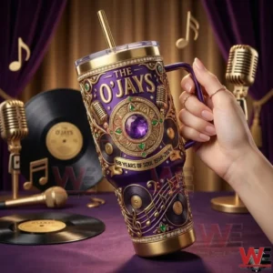 Hand holding purple music themed tumbler with vintage music props