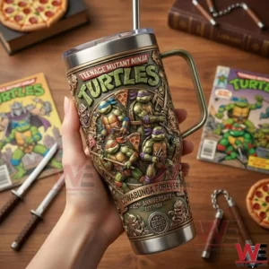 Hand holding a Teenage Mutant Ninja Turtles tumbler on a wooden table