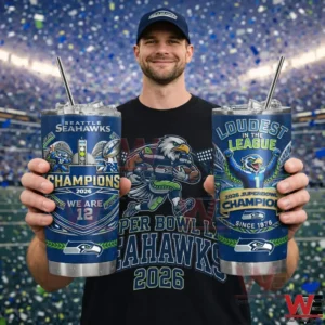 Man holding two Seattle Seahawks Champions 2026 tumblers in a stadium with confetti.