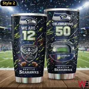 Two Seattle Seahawks We Are 12 celebrating 50 years tumblers in a stadium.