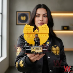 Person holding Wu Tang Clan anniversary building brick display with DJ stage and yellow logo!