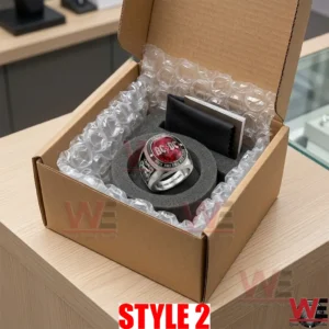 AC DC ring in a circular foam insert inside a shipping box with bubble wrap and a black cloth!