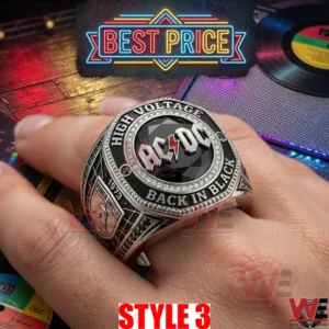Black stone AC DC ring on a finger with Back In Black text and a neon sign background!