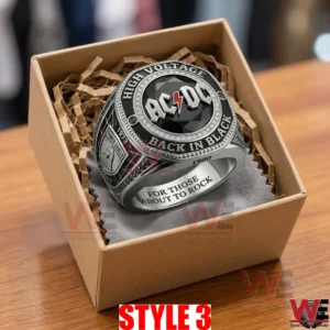 Silver AC DC ring with a black stone in a cardboard gift box on a grey cloth!