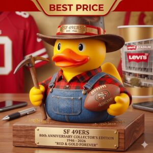 A San Francisco 49ers 80th anniversary gold miner rubber duck figurine on a desk with stadium memorabilia and a best price banner above it!