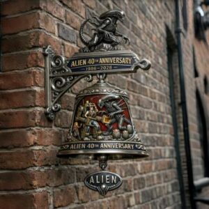 Alien Anniversary Wall Bell on a brick wall with a battle scene and logo!
