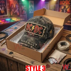An open cardboard box with bubble wrap holding the black AC DC cap!