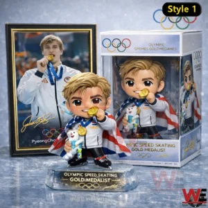 Collectible speed skating champion figure holding a gold medal beside its box and a framed athlete photo!