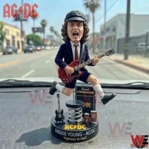Angus Young ACDC Highway to Hell Car Dashboard Bobblehead Figure 3 Close up of an Angus Young rock music figure jumping on a car dashboard with a street and blue sky in the distance!