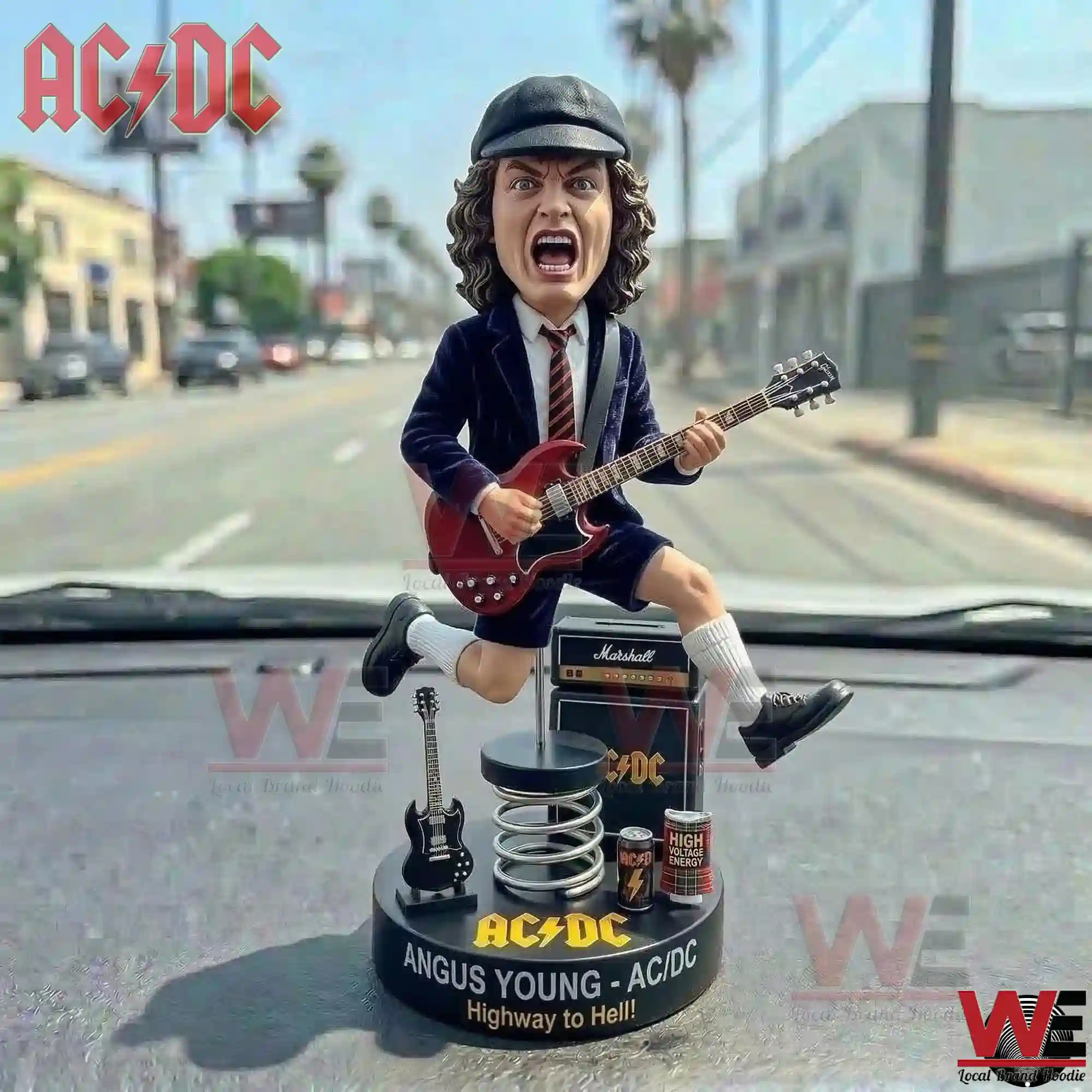 Angus Young ACDC Highway to Hell Car Dashboard Bobblehead Figure 2 Close up of an Angus Young rock music figure jumping on a car dashboard with a street and blue sky in the distance!