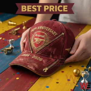 Red Arsenal anniversary cap on a colorful table with small trophy decorations!