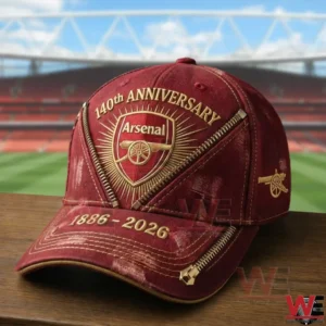 Arsenal FC 140 Years Anniversary Classic Cap 4 Red Arsenal anniversary cap on a table with a stadium in the background!