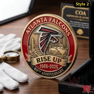 ATLANTA FALCONS 60TH ANNIVERSARY COIN 7 Atlanta Falcons 60th anniversary Rise Up coin standing on a table with gloves magnifier and certificate of authenticity behind it.