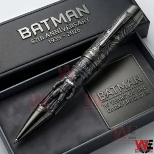 A dark silver pen with bat symbols and a sculpted figure resting inside a dark presentation box!